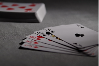 A picture containing text, queen, gambling houseDescription automatically generated
